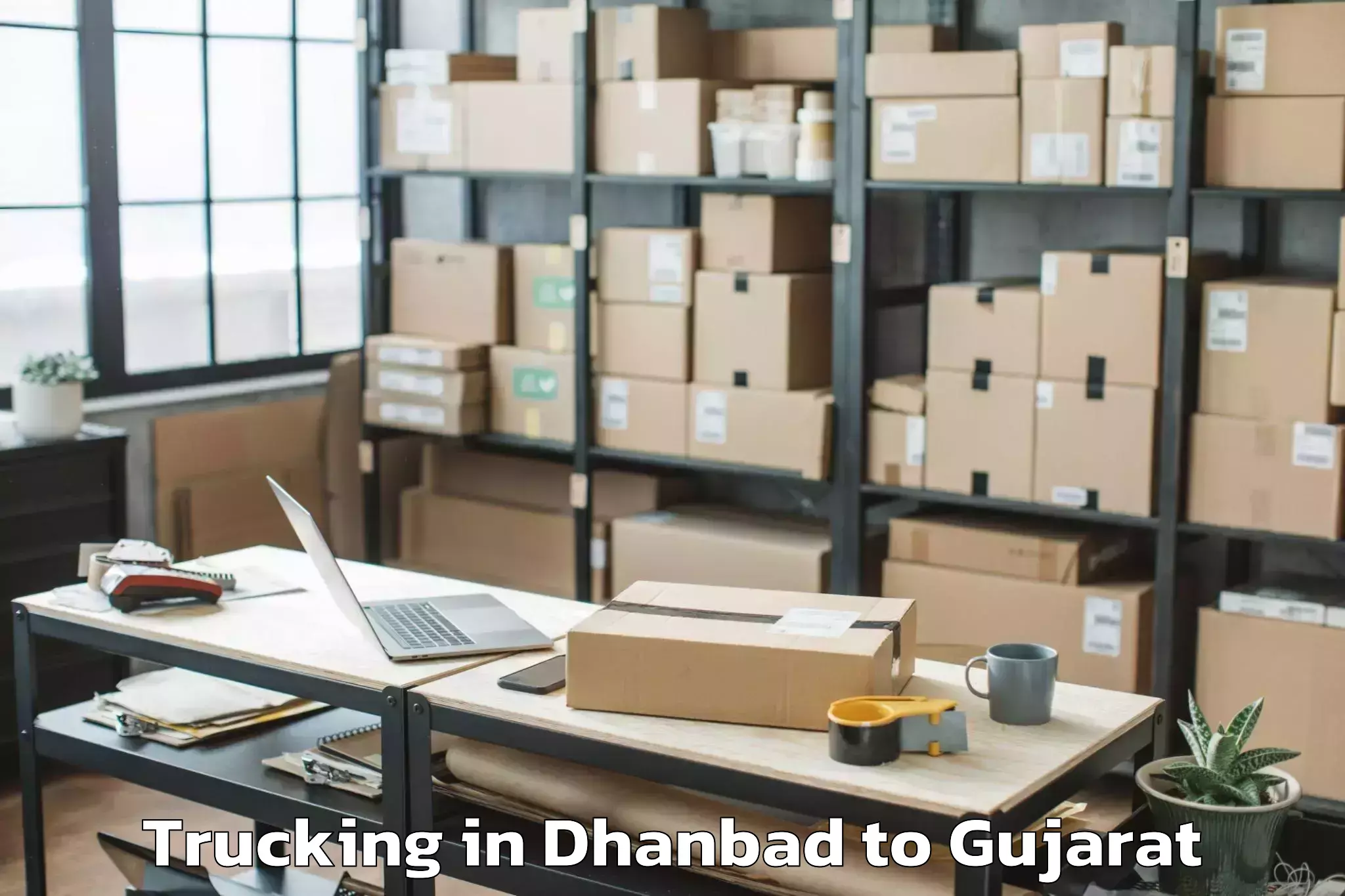 Affordable Dhanbad to Dholka Trucking